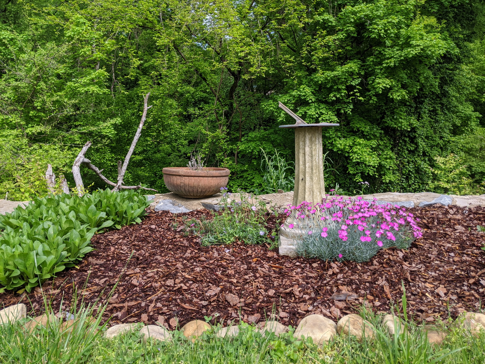 Garden sundial with flower border