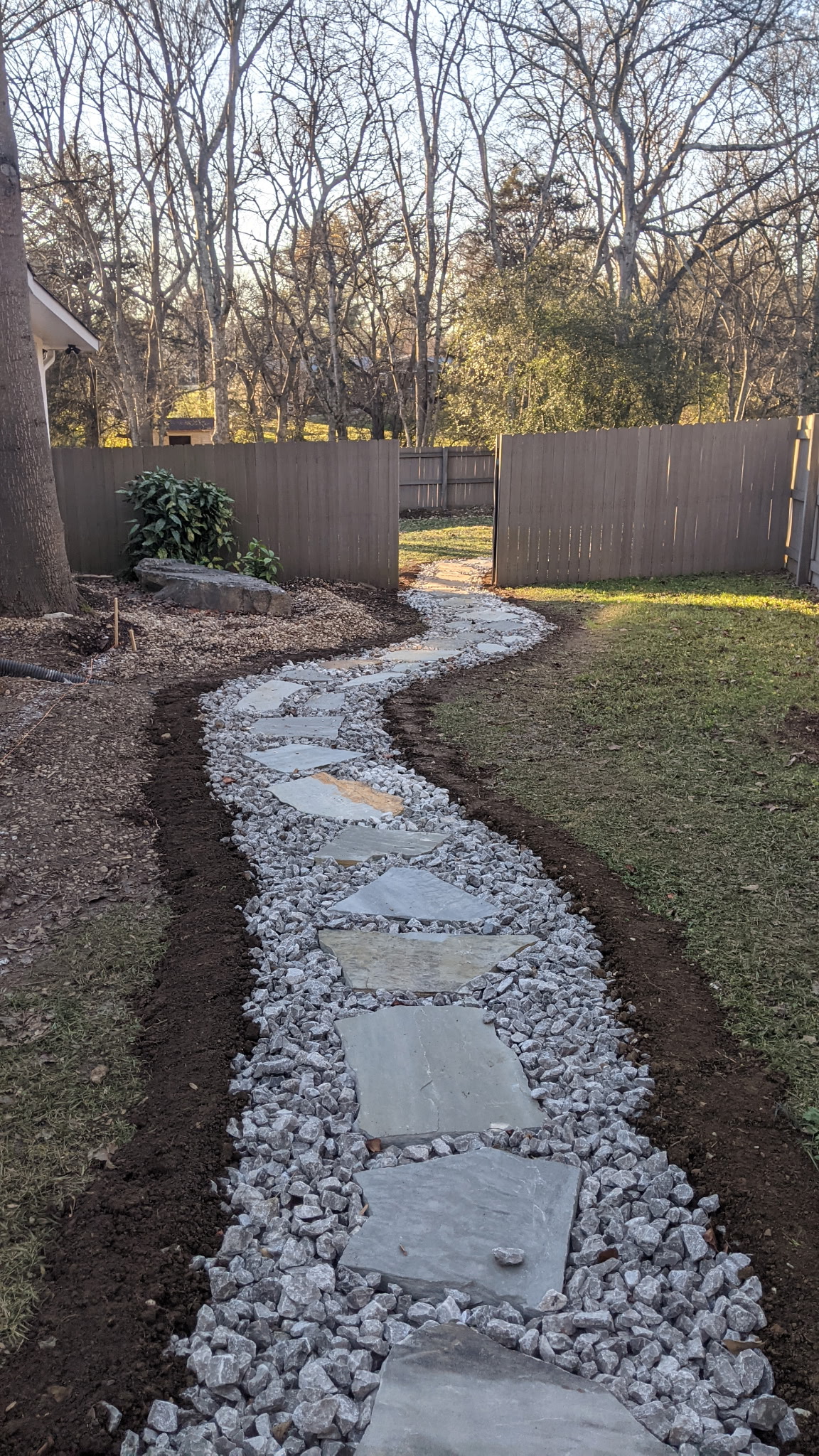 Stone pathway through residential yard